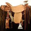 Half Breed Wade Saddle by Keith Valley   Specs: Wade tree by Rick Reed 16 inch seat Gullet - 7 & 1/2H by 6 & 1/4W by 4 94 Degree Bars Horn - 3 & 5/8ths high by 4 & 1/2 Guatelajara Cantle - 4&1/2 inches high by 12&1/2 inches wide Cheyenne Roll - 1 & 3/4 inches 7/8ths flat plate riggin, Vaquero Geometric Border with Sheridan Style Floral Stainless Steel Hardware - by Harwood 4&1/2 inch Monel Stirrups Santa Barbara twisted stirrup leathers Full length stirrup leathers 32 inch 100% Mohair Roper Cinch 7 foot latigos - both sides Ready to ride and go to work.